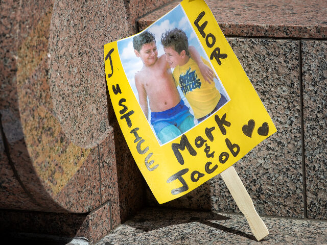 VAN NUYS, CA-APRIL 25, 2022: A sign shows an image of Mark Iskander, 11, left, and his bro
