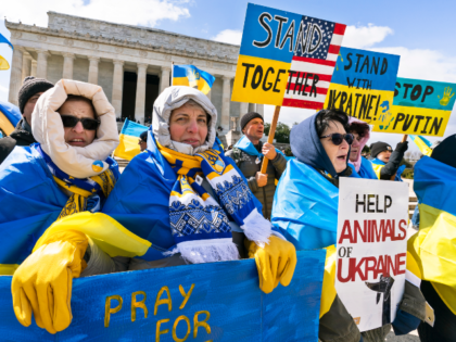 Supporters of Ukraine hold banners during a Stand with Ukraine rally at the Lincoln Memori