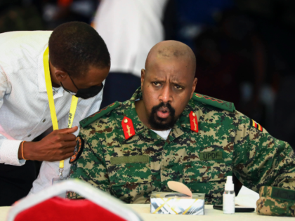 FILE - Then Lt. Gen. Muhoozi Kainerugaba, right, son of Uganda's President Yoweri Mus