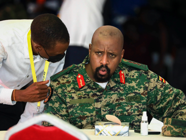 FILE - Then Lt. Gen. Muhoozi Kainerugaba, right, son of Uganda's President Yoweri Mus