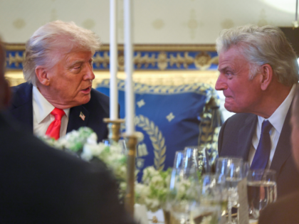 President Donald Trump talks with Rev. Franklin Graham during an Easter prayer service and
