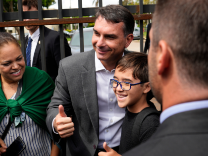 Senator Flavio Bolsonaro poses with supporters after visiting his imprisoned father, forme