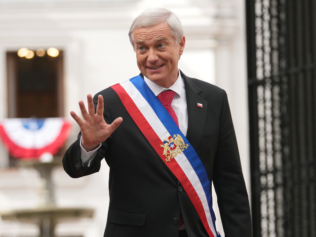 President Jose Antonio Kast waves at La Moneda Palace a day after his inauguration in Sant