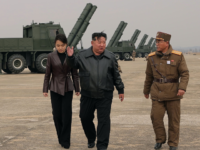 In this photo provided by the North Korean government, its leader Kim Jong Un, center righ