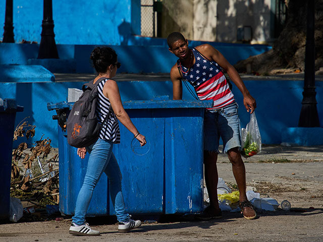 AP26086617378815 Title: Cuba Daily Life Image ID: 26086617378815 Article: A man wearing a U.S. flag motif s