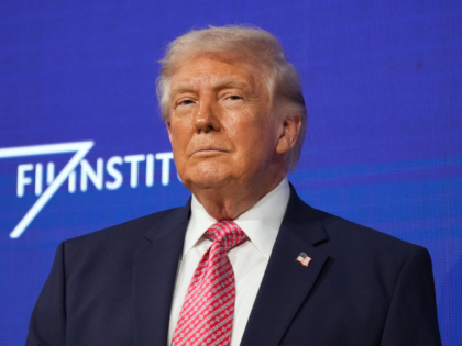 President Donald Trump prepares to speak at the Future Investment Initiative Institute