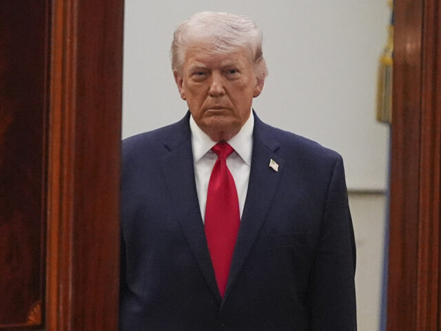 President Donald Trump arrives from the Blue Room to speak about the Iran war from the Cro