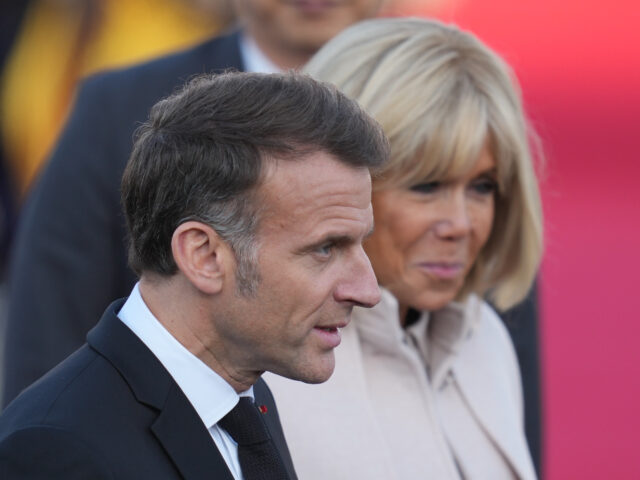 French President Emmanuel Macron and his wife Brigitte Macron arrive at the Seoul airport