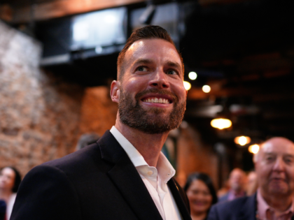Republican candidate Clay Fuller smiles as election results roll in during an election nig