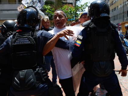 Bolivarian National Police stop protesters who are demanding higher salaries, pensions and