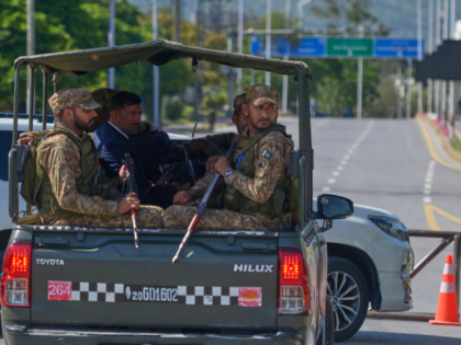 Army troops patrol at a road to ensure security ahead of the second round of the U.S. Iran
