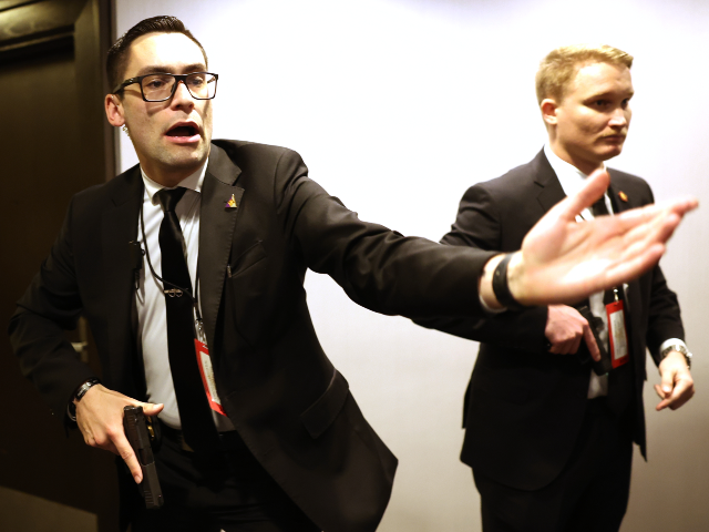 Members of law enforcement respond during the White House Correspondents Dinner, Saturday,