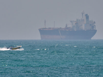 Title: Iran War Economy Image ID: 26117545379836 Article: FILE - A boat sails past a tanke