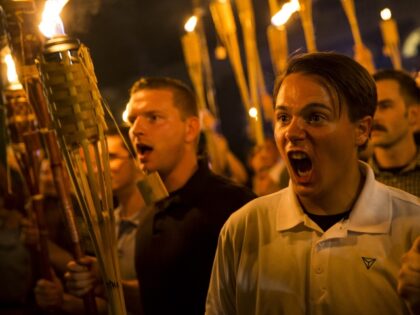 CHARLOTTESVILLE, USA - AUGUST 11: Peter Cvjetanovic (R) along with Neo Nazis, Alt-Right, a