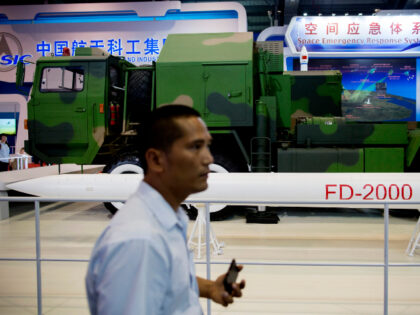 An attendee walks past a China Aerospace Science and Technology Corp. (CASC) FD-2000 air d