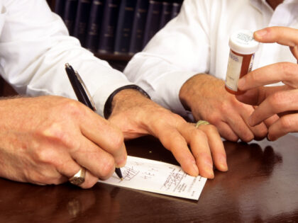 Doctor writing prescription