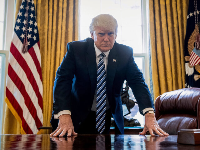 FILE - In this Friday, April 21, 2017, file photo, President Donald Trump poses for a port