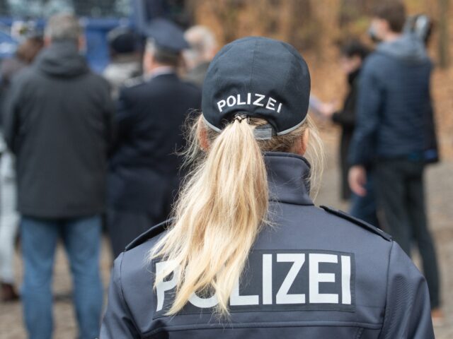 14 November 2018, Berlin: A policewoman stands at the presentation of the new special vehi