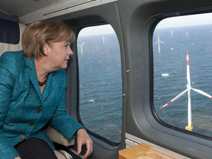 German Chancellor Angela Merkel looks out of the window of a helicopter as she overflies t