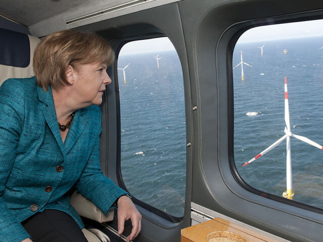 German Chancellor Angela Merkel looks out of the window of a helicopter as she overflies t