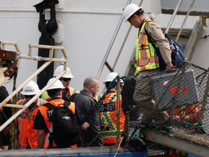 Officials from the Transportation Safety Board (TSB) of Canada board the Polar Prince, the