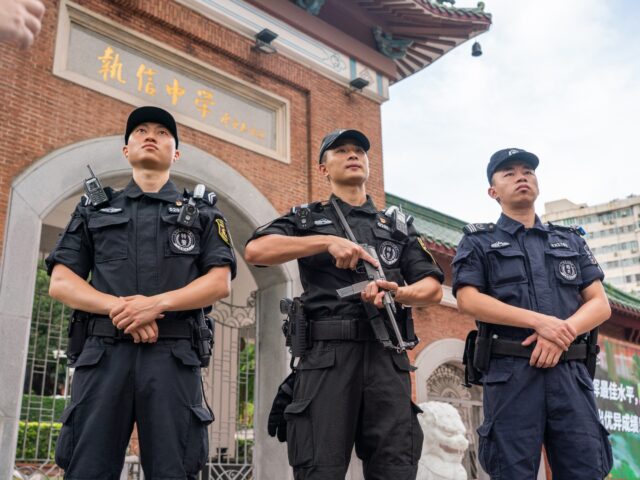 GUANGZHOU, CHINA - JUNE 07: Armed police stand guard outside an exam venue of the 2023 Nat