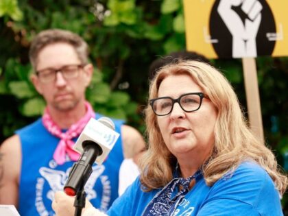 Vice President of the Writers Guild of America Michele Mulroney speaks as the Screen Actor