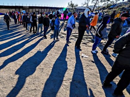 Jacumba, CA, Friday, November 24, 2023 - Migrants are given food from local volunteers at