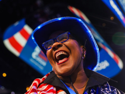 Regina Wallace-Jones of Palo Alto soaks up the first evening of the DNC Convention at the