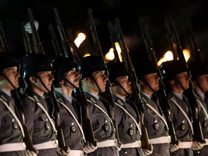 BERLIN, GERMANY - MAY 05: Soldiers from the guard battalion stand with torches during tatt