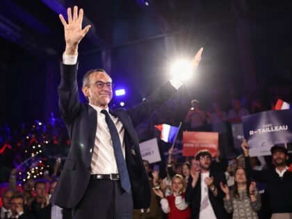 TOPSHOT - France's Minister of the Interior Bruno Retailleau waves from the stage during h