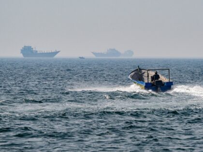 TOPSHOT - A boat sails in the waters of the Strait of Hormuz off Khasab in Oman's northern