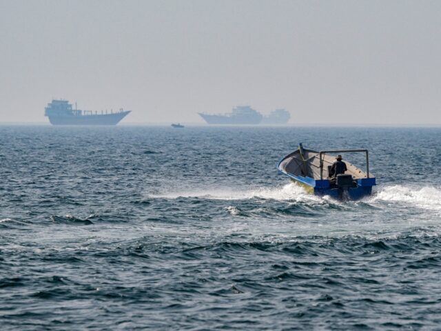TOPSHOT - A boat sails in the waters of the Strait of Hormuz off Khasab in Oman's northern