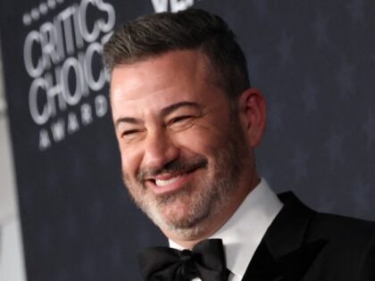 TV host Jimmy Kimmel poses in the press room with the Best Talk Show award for "Jimmy Kimm