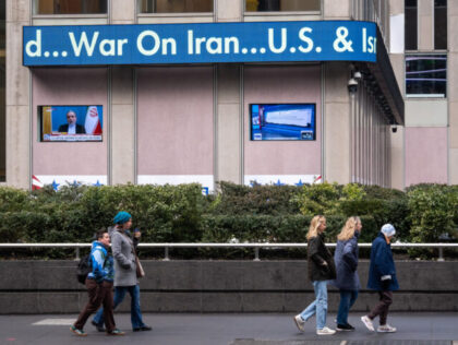 A news ticker displays news about US strikes on Iran on the News Corp. building in New Yor