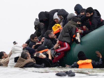 GRAVELINES, FRANCE - APRIL 01: Migrants board a dinghy before attempting to sail into the