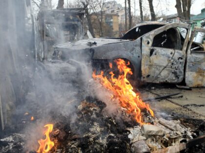 A fire burns near a car following the fall of a drone in Vyshneve, Kyiv region, Ukraine, o