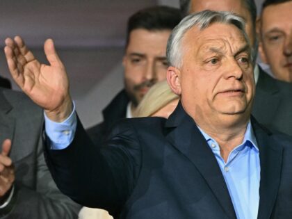 Hungary's Prime Minister Viktor Orban waves to supporters at the Balna centre in Budapest
