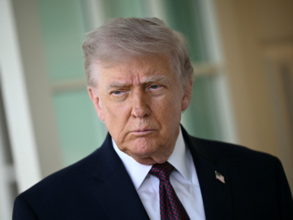 TOPSHOT - US President Donald Trump speaks to the press outside the Oval Office at the Whi