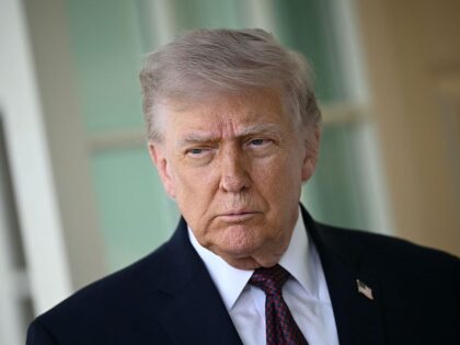 TOPSHOT - US President Donald Trump speaks to the press outside the Oval Office at the Whi