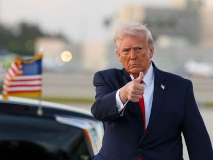 MIAMI, FLORIDA - APRIL 11: U.S. President Donald Trump waves to the media after walking of