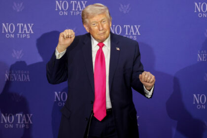 US President Donald Trump dances during a "No Tax on Tips" roundtable in Las Veg