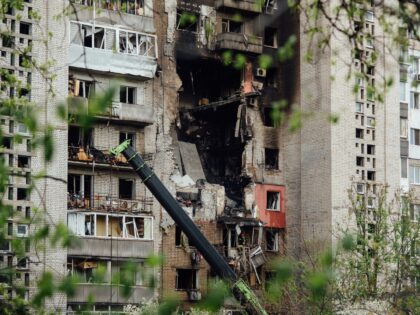 DNIPRO, UKRAINE - APRIL 23: Rescuers conduct search-and-rescue work in damaged residential