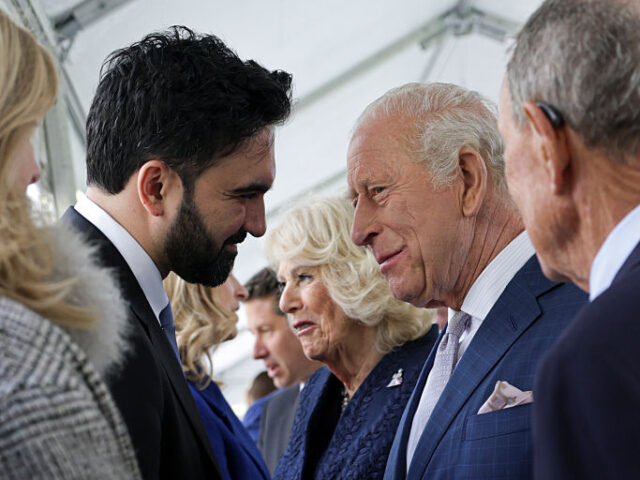 NEW YORK, NEW YORK - APRIL 29: King Charles III standing next to Queen Camilla interacts w