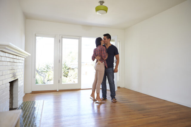 Romantic Couple In New Home On Moving Day