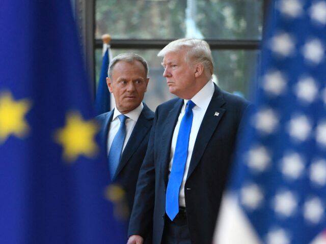 European Council President Donald Tusk (L) speaks to US President Donald Trump (R) as he w