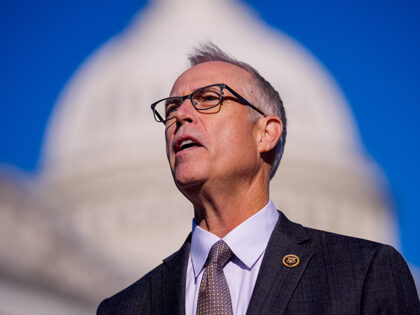 The Dome of the U.S. Capitol Building is visible as Rep. Jared Huffman (D-CA) speaks durin
