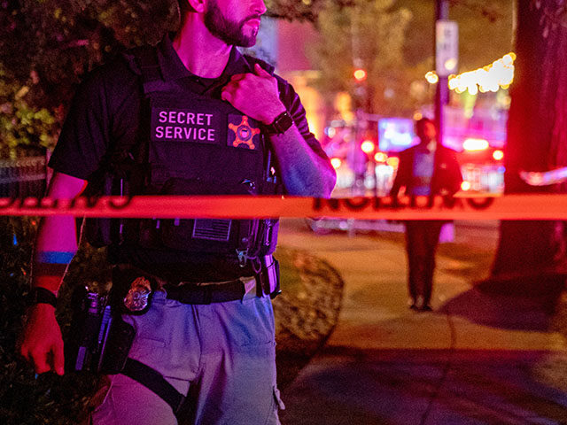 A US Secret Service agent stands in a closed-off area following reports of a shooting duri