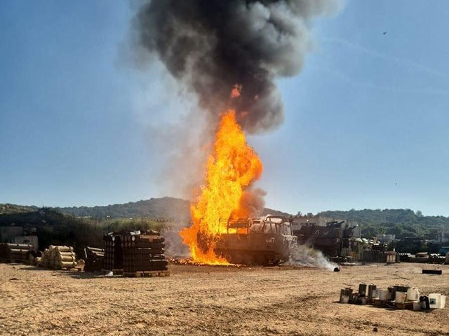 Smoke rises from an Israeli military position near the northern border town of Shomera, Is