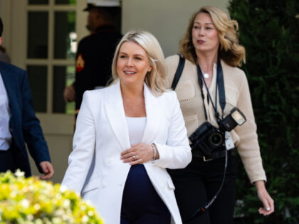 White House press secretary Karoline Leavitt walks to do a television interview at the Whi